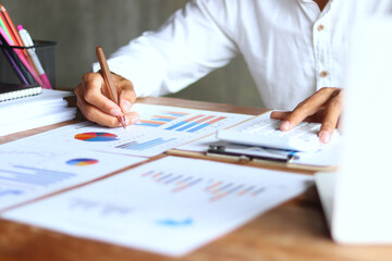 close up of person analyzing graphs