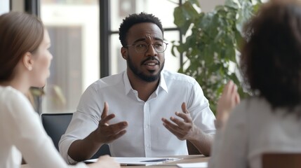 Compassionate communication in a workplace, with colleagues practicing active listening and nonviolent communication during a team meeting, fostering a respectful and inclusive environment