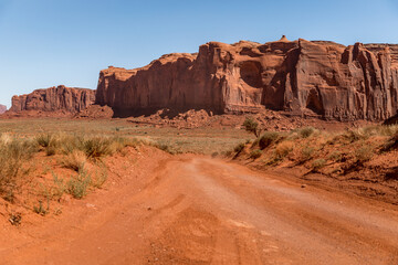 Scenic dirt road in the monuments in the Monument Valley, Arizona USA