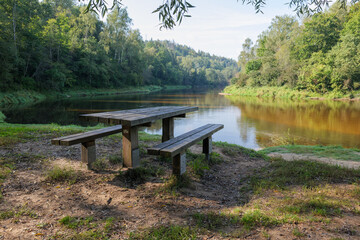 Picnic place with table and benches in national park Gauja, Latvia.