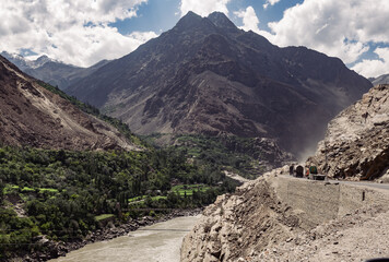 A mountain range with a river running through it and a dangerous road