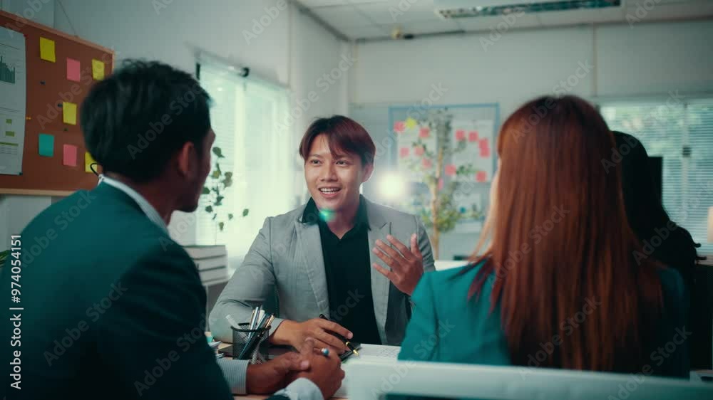 Poster businesspeople engage in a discussion with a manager during a meeting in a startup office, focusing 