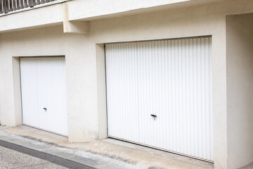 portal garage door street flat apartment facade car door with closed steel gate curtain