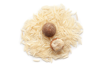 A pile of rice with Betel Nuts (Areca catechu). Isolated on a white background.