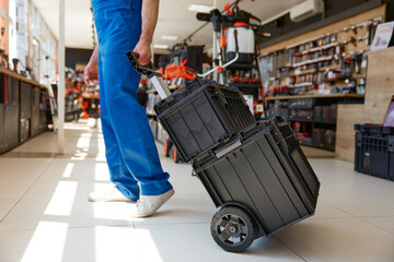 Fototapeta premium Handyman worker purchasing industrial tools kit at hardware store department