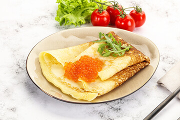 Russian pancake with red caviar