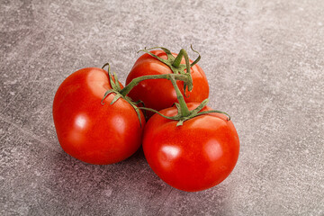 Sweet ripe tomatoes on the branch