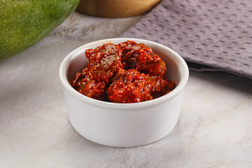 Spicy pickled raw green mango