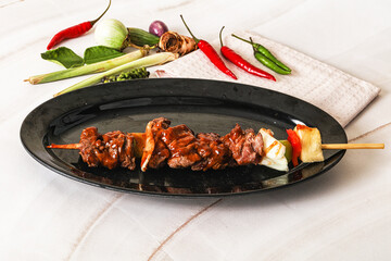 Asian grilled beef skewer with vegetables and pineapple