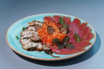 Exquisite Assorted Sashimi Platter on Elegant Blue Ceramic Plate
