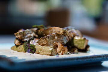 Gourmet Close-Up of Grilled Zucchini with Herbs on Elegant Plate