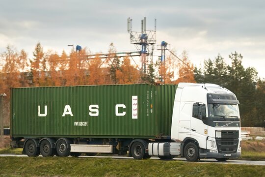 14.09.2024 Poland, Europe. Green UASC container on white truck on highway