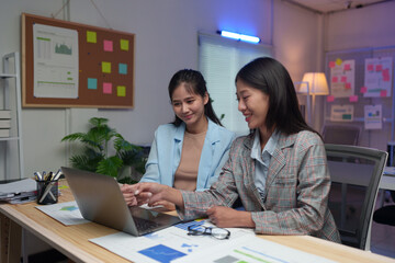 Female company employees and coworkers work together in the office Talking and giving advice Consult on management guidelines, calculations, recording data for meetings and summarizing income results.