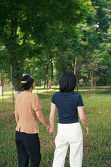 Young Asian woman walking with her mother in the park