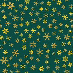 Many small yellow irregular snowflakes on green background. Seamless pattern with snowflakes. Snowflake ornament vector illustration. Decorative design in traditional colors with winter mood.
