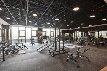 A gym equipped with various exercise equipment.