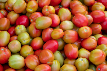 Fresh ripe tomatoes sold in a supermarket. Fresh red tomatoes, Red tomatoes background