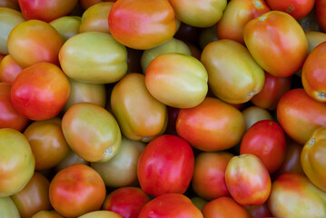 Fresh ripe tomatoes sold in a supermarket. Fresh red tomatoes, Red tomatoes background