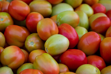 Fresh ripe tomatoes sold in a supermarket. Fresh red tomatoes, Red tomatoes background