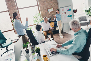Obraz premium Photo of teamwork startup partners discussion statistics trading comfortable nice creative startup office loft room interior