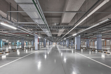 Underground Parking Garage with Shiny Floor, Symmetrical Perspective