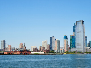 Fototapeta premium View of New Jersey from New York. Jersey City. Waterfront. Liberty Towers. New Port buildings. Path Hoboken station. Statue Cruises Departure.