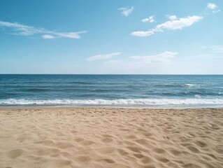 Fototapeta premium An empty beach scene with a calm sea and open sky offers a serene natural backdrop. 