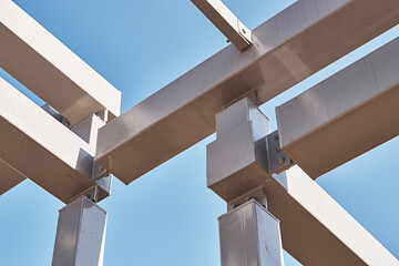 Fototapeta premium Abstract Architectural Beams Against Blue Sky, Minimal Geometry