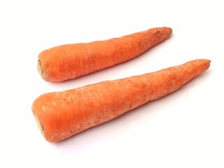 Two fresh carrots are displayed on a white background