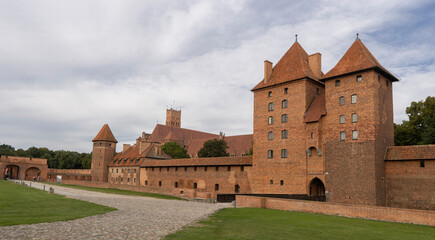 Panorama of a fragment of the Teutonic castle walls, dedicated to the Blessed Virgin Mary. Malbork - Poland.