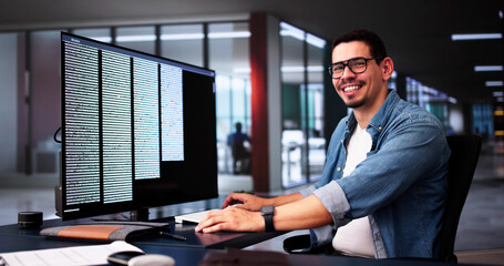 Computer Programmer Writing Program Code On Computer