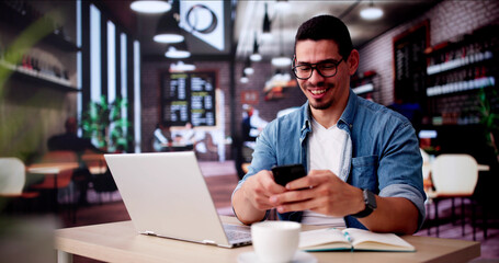 Student Using Phone And Laptop