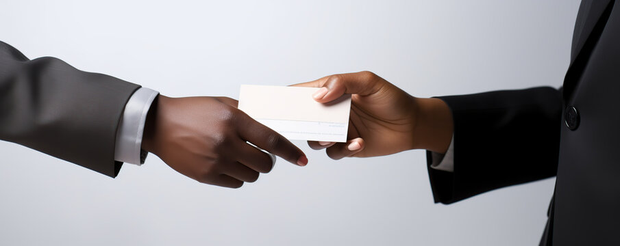 business professionals exchanging a business card