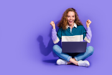 Full size photo of nice young girl laptop raise fists isolated on violet color background