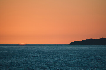 Last rays of sun at sunset on the coast of southern Spain. Dusk.