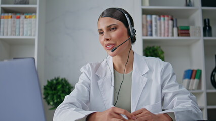 Clinic consultant talking headset providing customer service in clinic closeup