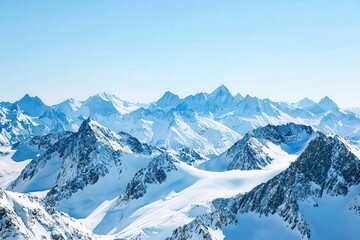 Obraz premium Breathtaking view of snow-covered mountains under a clear blue sky, showcasing nature's stunning beauty and tranquility.