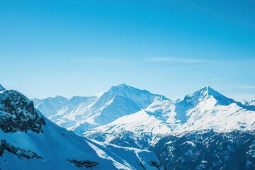 Obraz premium Breathtaking view of snow-capped mountains under a clear blue sky, showcasing nature's beauty and tranquility in winter landscape.