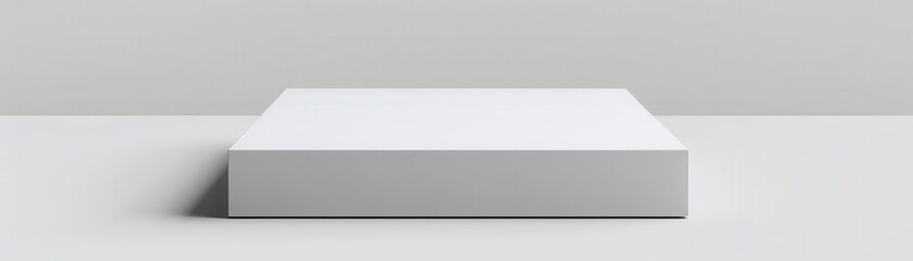 White box on a white surface. Minimalist product display.