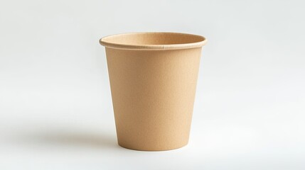 A single, empty, brown paper coffee cup stands on a white background.