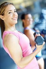 Fototapeta premium Weights, happy and woman in gym for workout, bodybuilder training and exercise for health. Fitness, sports and person with weightlifting equipment for strength, muscles and wellness for strong arms