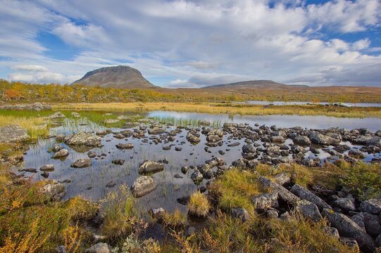 Autumn view of Saana Fell from Tsahkal Lake near Kilpisjarvi village, Lapland, Finland