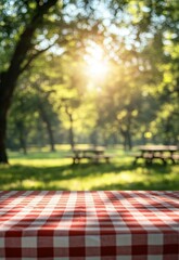A red and white checkered tablecloth on an outdoor picnic bench