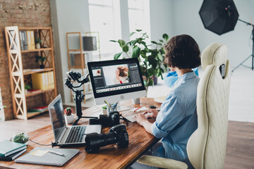 Photo of sweet charming camera woman wear shirt retouching photo modern gadget indoors workplace workstation