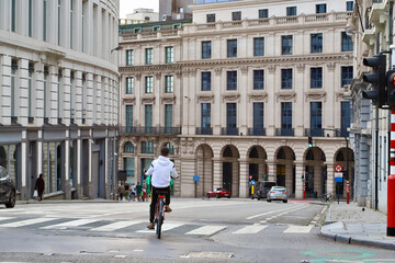 person riding a bicycle in the city
