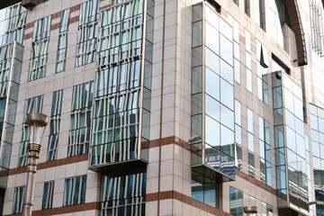 facade of a building reflecting another facade