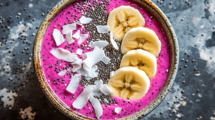 Fototapeta premium Vibrant Dragonfruit Smoothie Bowl with Chia Seeds and Bananas