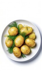Young potatoes with greens on a plate, top view