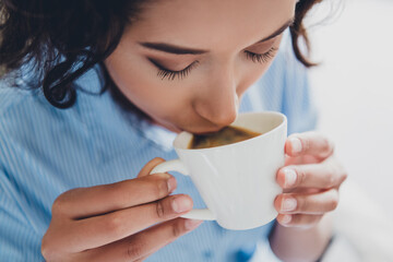 Photo of sweet dreamy lady assistant wear shirt drinking morning beverage indoors workplace workstation