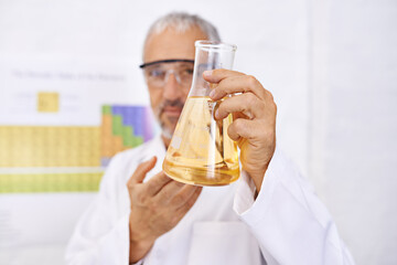 Man, scientist and beaker with chemical compound for experiment, liquid or medical breakthrough at...